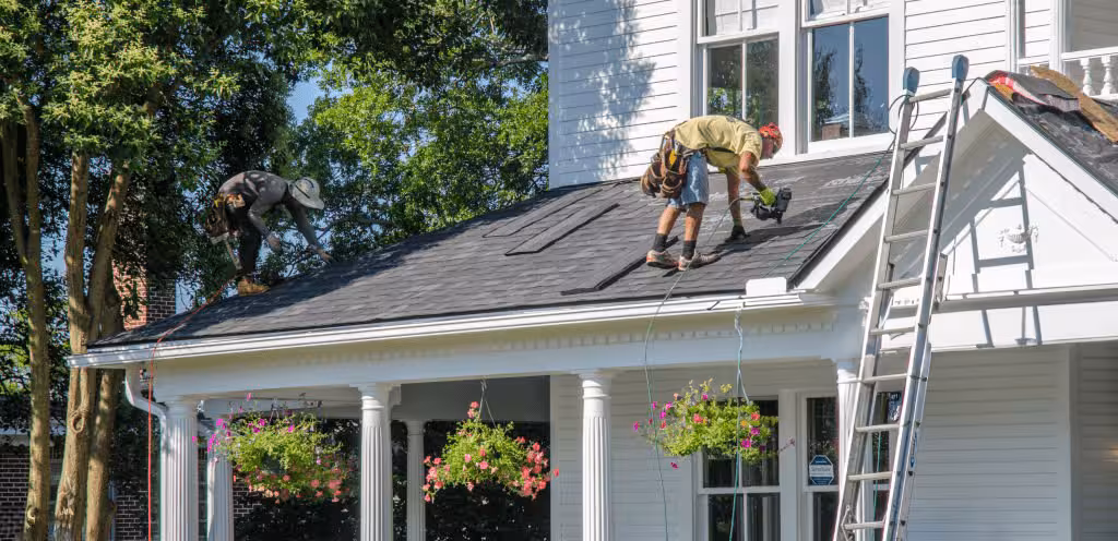 Licensed roofing contractors in Markham completing a full roof tear-off and replacement using high-quality shingles.